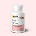 Dose Raab Vitalfood Eisen Komplex mit 80 veganen Kapseln, mit zweiwertigem Eisen, Vitamin C und Fruchtextrakten, auf rosa Hintergrund.